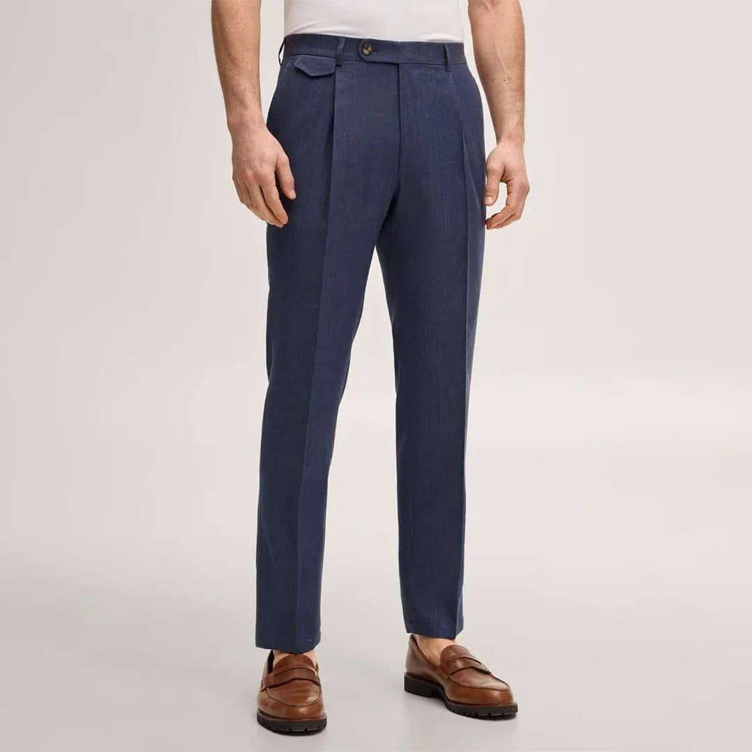 Image showing a tailor taking precise measurements for custom dress pants to ensure perfect fit and comfort for the wearer.
